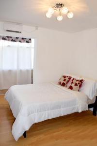 Ένα ή περισσότερα κρεβάτια σε δωμάτιο στο Sarli´s Patagonia