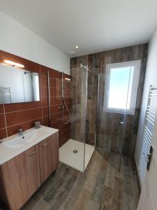 a bathroom with a shower and a sink at Le clos des baigneurs in Dolus d'Oléron +49 photos