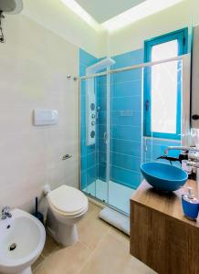 a bathroom with a toilet and a sink and a shower at Al Mare in Gallipoli