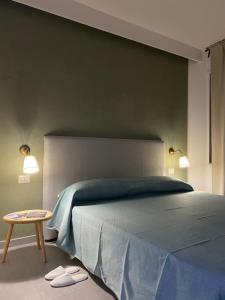 Postel nebo postele na pokoji v ubytování B&B Barù