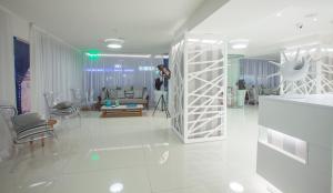 a man is taking a picture of a living room at Princessa Vera Hotel Apartments in Paphos