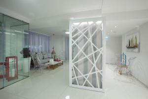 a living room with a sliding glass door at Princessa Vera Hotel Apartments in Paphos