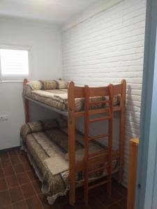 a room with two bunk beds in it at Apartamento vistas al mar de La Pineda in Salou