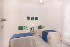 Ένα ή περισσότερα κρεβάτια σε δωμάτιο στο Maison Dora