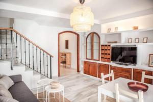 a living room with a couch and a table at 13 - EL DUPLEX de la ALAMEDA - ENJOY TARIFA in Tarifa