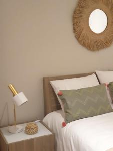 a bedroom with a bed and a table with a lamp at Vivenda Oliveira - Alojamento Local in Lamego +33 photos