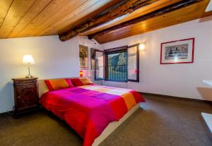 Un pat sau paturi într-o cameră la Le Residenze Del Conte Agudio
