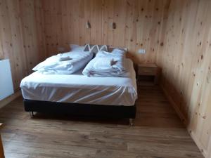 a bedroom with a bed with two birds on it at Greystone summerhouse in Egilsstaðir