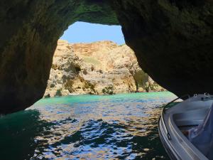 a view of a river from a boat in a cave at FM Central Vila Apartment in Carvoeiro