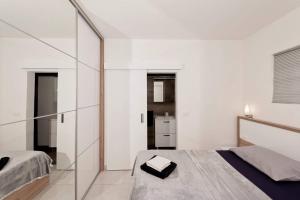 Postel nebo postele na pokoji v ubytování Apartment White Pearl