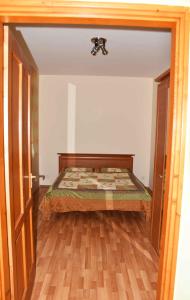 A bed or beds in a room at Pilikán Apartments Lenti