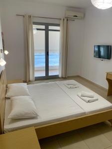 Ein Bett oder Betten in einem Zimmer der Unterkunft Blue Sea Apartments