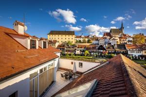a view of a town from the roofs of buildings at Pension Fortna in Český Krumlov