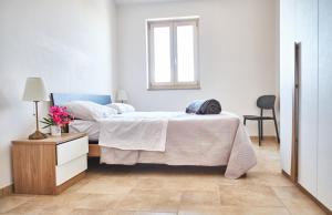 En eller flere senge i et værelse på Villa Dublin - Mare Blu 2 - Ostuni