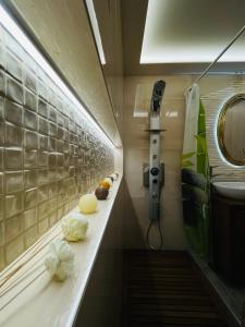 a bathroom with a counter with some food on it at Kapsalakis Penthouse in Korinthos +36 photos