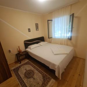 Ivan's Holiday Home tesisinde bir odada yatak veya yataklar