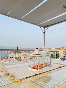a tray of donuts sitting on top of a roof at Kapsalakis Penthouse in Korinthos