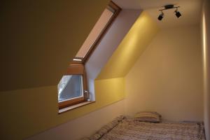 a bedroom with a bed and a window at Apartment MT Čezsoča in Bovec