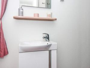 a bathroom with a sink and a mirror at Panoramic Cottage Retreat-By Traum in Hejls