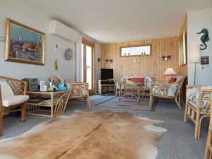 a living room filled with furniture and a table at Panoramic Cottage Retreat-By Traum in Hejls +28 photos