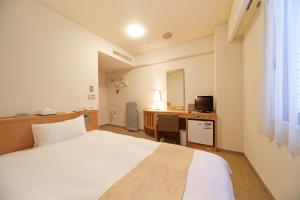 Voodi või voodid majutusasutuse Nest Hotel Kumamoto toas