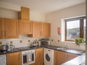 Kuchyň nebo kuchyňský kout v ubytování Clifden River View Apartment