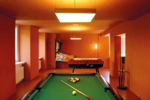 a billiard room with a pool table in a room at Davos Youth Hostel in Davos