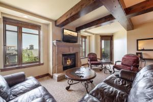 a living room with a couch and a fireplace at Luxury Resort Ski In Ski Out Hyatt Centric Residence 1BR Condo Pool Gym Hot tub Restaurant More in Park City