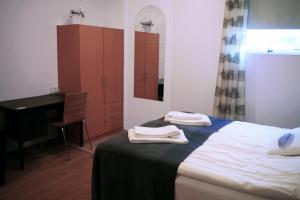 SAXA Guesthouse tesisinde bir odada yatak veya yataklar