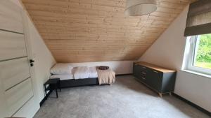 Posteľ alebo postele v izbe v ubytovaní Przystań pod Witoszą