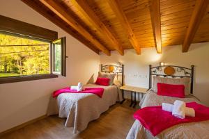 Ein Bett oder Betten in einem Zimmer der Unterkunft LA PANDELA