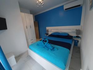 Posteľ alebo postele v izbe v ubytovaní TJ Apartment
