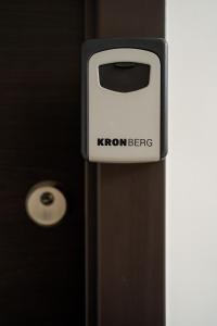 a sign that says kronbenz on the side of a door at HOME FOR SEVEN in Mamaia Sat/Năvodari