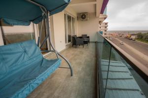 a hospital room with a bed and a view of a highway at HOME FOR SEVEN in Mamaia Sat/Năvodari