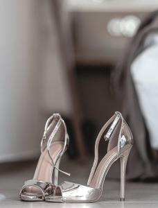 a pair of silver shoes sitting on a table at La Finca - Saint Vlas in Sveti Vlas