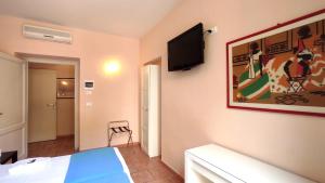 TV a/nebo společenská místnost v ubytování Hotel Rita Major