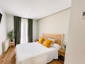 Tempat tidur dalam kamar di Hotel Camino de las Estrellas