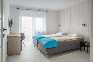 Posteľ alebo postele v izbe v ubytovaní Family Homes - Sand House