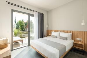 Postel nebo postele na pokoji v ubytování Yuka Villas Collection