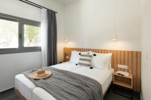 Postel nebo postele na pokoji v ubytování Yuka Villas Collection