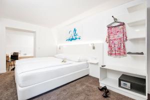 Postel nebo postele na pokoji v ubytování Hotel Velden - 24 Checkin Zimmer im Zentrum