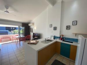 a kitchen with a sink and a counter top at Noosa Retreat in Noosa Heads