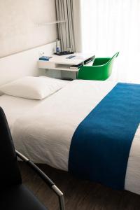 Voodi või voodid majutusasutuse Seminarhotel Lihn toas