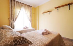 A bed or beds in a room at Casa Sandra Spainsunrentals 1165