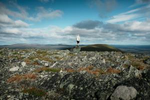 a man standing on top of a mountain at Lapland Hotels Riekonlinna in Saariselka