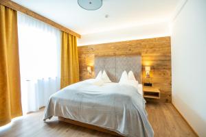 Łóżko lub łóżka w pokoju w obiekcie Apartment Bergsee
