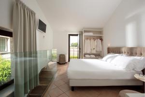 Posteľ alebo postele v izbe v ubytovaní Giotto Country House & Spa