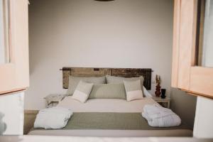 Postel nebo postele na pokoji v ubytování VENTITRÈ- House of Apulia Mea