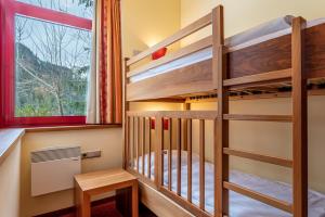 Voodi või voodid majutusasutuse Hotel Tyrol am Haldensee toas
