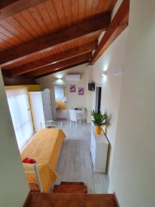 a view of a kitchen and a living room at Colle Del Mirto in Castelnuovo Cilento